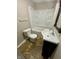 Functional bathroom featuring a shower-tub combination, toilet, and vanity with a dark wood cabinet at 1019 E Jackson St, Shelbyville, IN 46176