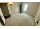 Bedroom boasts plush carpeting, neutral paint, and a comfortable atmosphere for relaxation at 1019 E Jackson St, Shelbyville, IN 46176