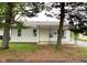 Charming one-story home featuring a clean exterior, small front porch, and tidy landscaping at 1019 E Jackson St, Shelbyville, IN 46176