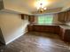 Kitchen features ample cabinetry, updated countertops, a double sink, and modern flooring at 1019 E Jackson St, Shelbyville, IN 46176
