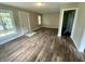 Well-lit living room with hardwood flooring, neutral paint, and a welcoming entrance at 1019 E Jackson St, Shelbyville, IN 46176