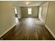 Open living room showcases hardwood flooring, neutral paint, bright natural light, and an inviting atmosphere at 1019 E Jackson St, Shelbyville, IN 46176