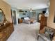 Expansive light-filled main bedroom featuring blue walls, hardwood furniture, and neutral carpeting at 10190 Holly Berry Cir, Fishers, IN 46038