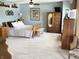 Spacious bedroom boasting natural light, light blue walls, and beautiful wood furniture at 10190 Holly Berry Cir, Fishers, IN 46038