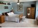 Spacious bedroom boasting natural light, light blue walls, and beautiful wood furniture at 10190 Holly Berry Cir, Fishers, IN 46038