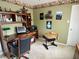 Versatile bedroom with a functional desk setup and ample storage, complemented by unique decorative accents and natural light at 10190 Holly Berry Cir, Fishers, IN 46038