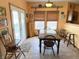 Bright dining area with large windows and a decorative table set at 10190 Holly Berry Cir, Fishers, IN 46038