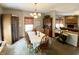 Comfortable dining room adjacent to the living space and a side door at 10190 Holly Berry Cir, Fishers, IN 46038