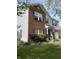 Two-story home featuring brick and vinyl siding, complemented by well-kept landscaping and decorative elements at 10190 Holly Berry Cir, Fishers, IN 46038