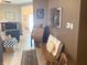 Inviting hallway featuring a decorative bench, a vintage desk, and hardwood flooring at 10190 Holly Berry Cir, Fishers, IN 46038