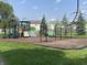 Community playground featuring slides, climbing structure and swings at 10190 Holly Berry Cir, Fishers, IN 46038