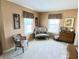 Cozy sitting room featuring comfortable seating and natural light streaming through the windows at 10190 Holly Berry Cir, Fishers, IN 46038