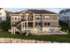 A spacious backyard features a pool and stairs leading to a deck overlooking the lawn at 10590 Geist View Dr, Fishers, IN 46055