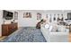 Finished basement featuring a comfortable sofa and musical instruments displayed on the wall at 10590 Geist View Dr, Fishers, IN 46055
