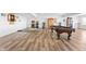 Large basement featuring a pool table, arcade games, and durable flooring at 10590 Geist View Dr, Fishers, IN 46055