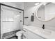 Modern bathroom features a glass-enclosed shower, stylish fixtures, and a white marble countertop at 10590 Geist View Dr, Fishers, IN 46055