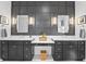 Modern bathroom featuring double sinks, and a decorative wall at 10590 Geist View Dr, Fishers, IN 46055