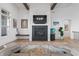 Modern fireplace with shiplap accent wall, floating shelf and art at 10590 Geist View Dr, Fishers, IN 46055