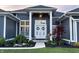 Beautiful front exterior featuring a well-manicured lawn and a welcoming entrance with decorative accents at 10590 Geist View Dr, Fishers, IN 46055