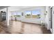 Bright living room boasting multiple windows, durable flooring, and lovely views at 10590 Geist View Dr, Fishers, IN 46055