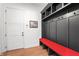 Organized mudroom features a bench, coat hooks, and storage cubbies, perfect for entryway organization at 10590 Geist View Dr, Fishers, IN 46055