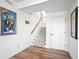 Staircase with carpeted steps and wood railing, leading to the upper level of the home at 10590 Geist View Dr, Fishers, IN 46055