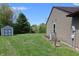 Spacious, green backyard featuring a storage shed and views of the surrounding landscape at 109 Buckthorne Ln, Mooresville, IN 46158