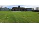 Large green backyard and concrete patio area, perfect for outdoor living and entertaining at 109 Buckthorne Ln, Mooresville, IN 46158
