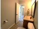 Bathroom featuring a vanity, mirror, and toilet with tile flooring visible at 109 Buckthorne Ln, Mooresville, IN 46158