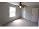 Bright bedroom featuring neutral walls, carpet, a ceiling fan, and a window with natural light at 109 Buckthorne Ln, Mooresville, IN 46158