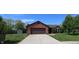 Charming single-story brick home featuring an attached garage and a well-maintained front yard at 109 Buckthorne Ln, Mooresville, IN 46158