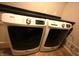 Modern white front-load washer and dryer with black countertop at 109 Buckthorne Ln, Mooresville, IN 46158