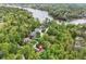 Aerial shot of a lakeside neighborhood with lovely homes and lush landscaping, creating a picturesque and peaceful environment at 10919 Running Tide Ct, Indianapolis, IN 46236