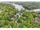 Stunning aerial view of a lakeside community with tree-lined streets and beautiful homes, offering a serene living experience at 10919 Running Tide Ct, Indianapolis, IN 46236