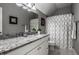 Stylish bathroom featuring a granite countertop and decorative mirror at 10919 Running Tide Ct, Indianapolis, IN 46236