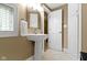Bathroom featuring a pedestal sink with bright natural lighting at 10919 Running Tide Ct, Indianapolis, IN 46236