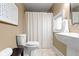 Bathroom with a toilet, sink and decorative shower curtain at 10919 Running Tide Ct, Indianapolis, IN 46236