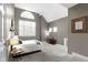 Comfortable bedroom with soaring ceilings, large windows and neutral tones at 10919 Running Tide Ct, Indianapolis, IN 46236