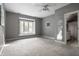 Spacious bedroom featuring large window with an outdoor view at 10919 Running Tide Ct, Indianapolis, IN 46236