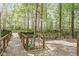 Expansive wooden deck overlooking a lush, wooded area, providing an ideal space for relaxation and outdoor entertainment at 10919 Running Tide Ct, Indianapolis, IN 46236