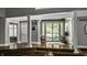 Elegant entryway with pillars, wood flooring, and glass doors leading to the outdoor area at 10919 Running Tide Ct, Indianapolis, IN 46236