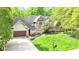 Beautiful two-story brick home with a well-manicured lawn and mature trees at 10919 Running Tide Ct, Indianapolis, IN 46236