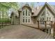 Back exterior view showcasing large deck, multiple windows, and attractive architectural design, enhancing curb appeal at 10919 Running Tide Ct, Indianapolis, IN 46236