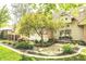 Landscaped front yard with mature trees and a quaint walkway leading to the entrance at 10919 Running Tide Ct, Indianapolis, IN 46236