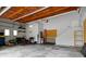 Spacious garage with ample storage, workbench area, and overhead lighting for functionality and organization at 10919 Running Tide Ct, Indianapolis, IN 46236
