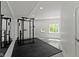 Bright home gym complete with mirrored wall and exercise equipment at 10919 Running Tide Ct, Indianapolis, IN 46236