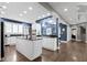 Bright kitchen featuring white cabinetry, stainless steel appliances and a large island at 10919 Running Tide Ct, Indianapolis, IN 46236