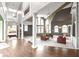 Spacious living room with soaring ceilings, large windows, and stylish furnishings at 10919 Running Tide Ct, Indianapolis, IN 46236