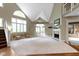Spacious living room with high ceilings, a fireplace, large windows, and neutral decor at 10919 Running Tide Ct, Indianapolis, IN 46236