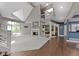 Open living area with fireplace, staircase, and view of the loft and kitchen at 10919 Running Tide Ct, Indianapolis, IN 46236